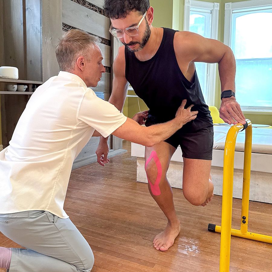 Mark guiding a patient through a single-leg strength exercise